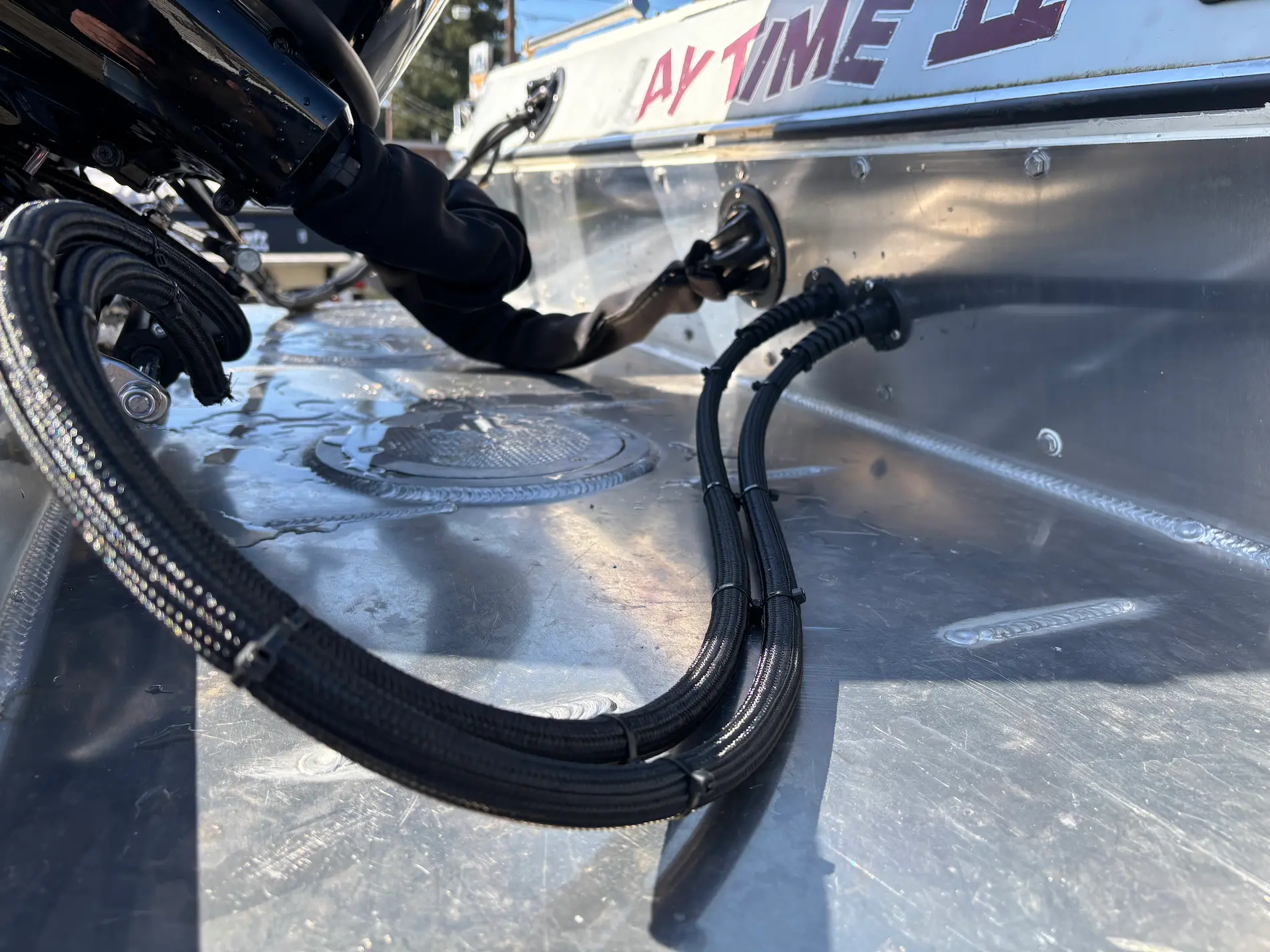 Close view of boat rigging and hose connections